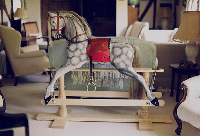 English dapple rocking horse place in sitting room